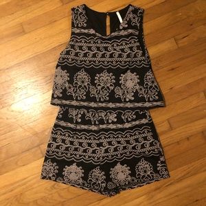 Gorgeous black romper with textured embroidery